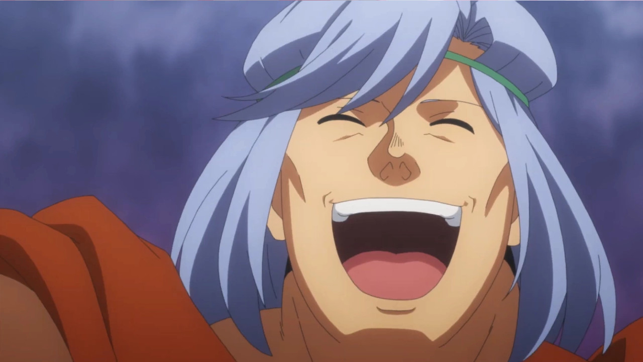 A man with blue hair flashes an infectious smile.